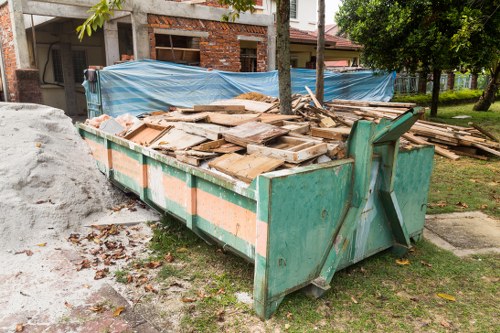 Construction site with builders waste being cleared
