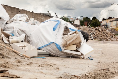 Professionals managing house clearance items