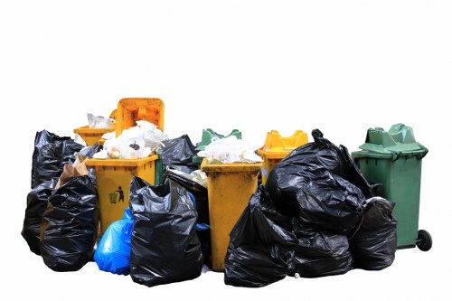 Workers managing builders waste clearance
